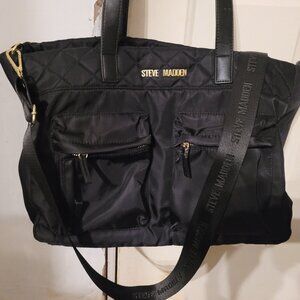 A large black Steve Madden Crossbody Bag